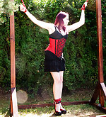 Captured redhead gets roped outdoors